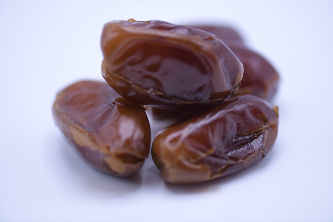 Close-up of glossy premium Aseel dates